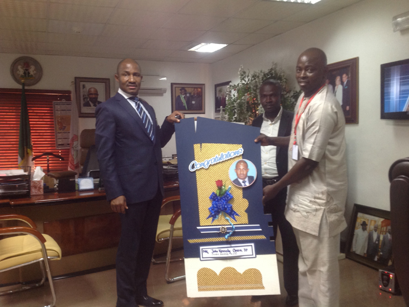 YOWICAN PRESENTS A CONGRATULATORY CARD TO THE ES NCPC AS THE OUTSTANDING PUBLIC SERVANT OF THE YEAR AWARD – 2013